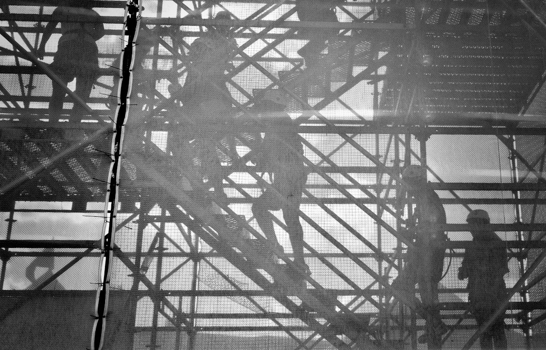 black and white photo of people going upstairs
